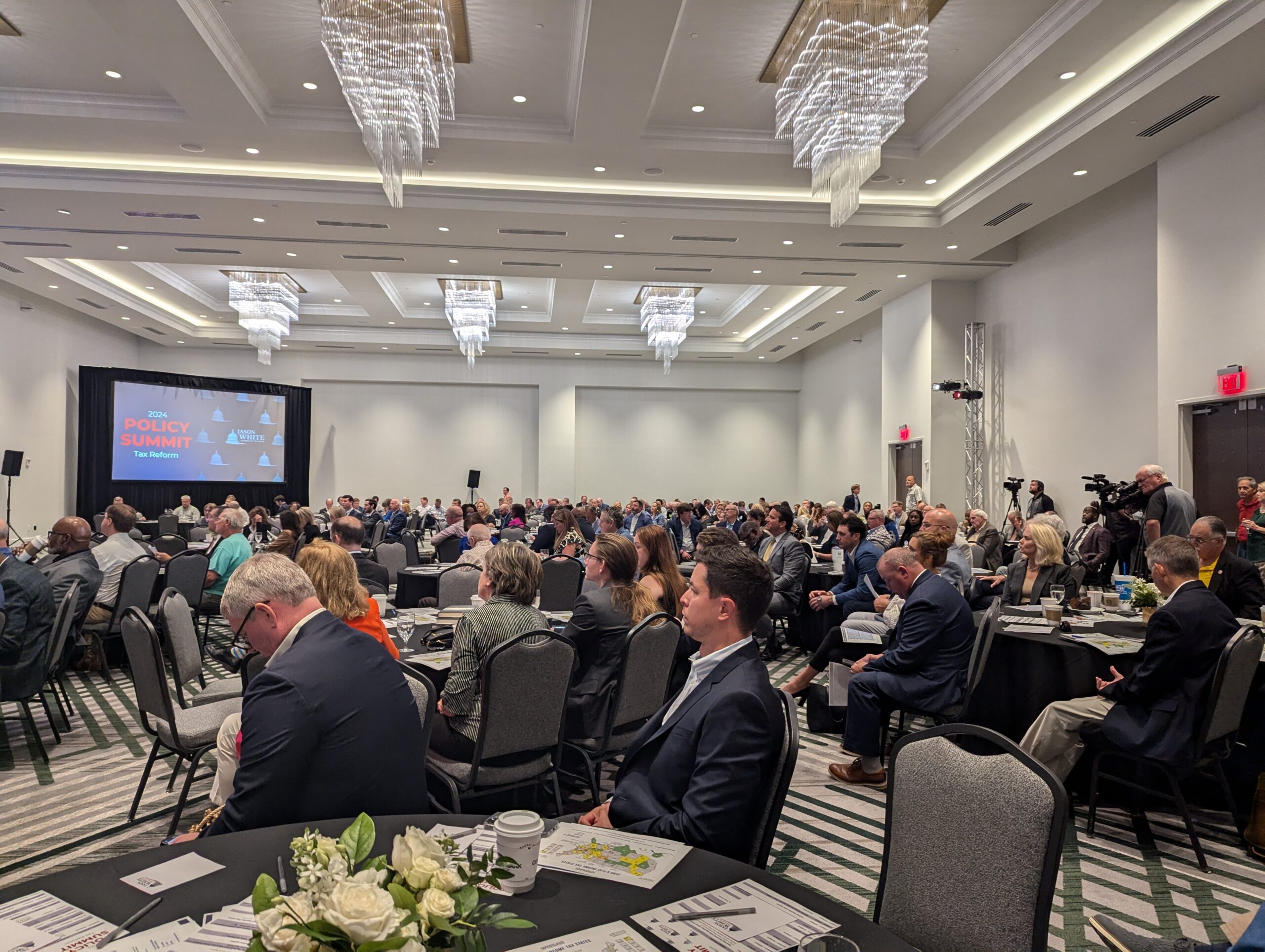 The room is full of more than 500 officials and legislators attend the 2024 Policy Summit and Tax Reform