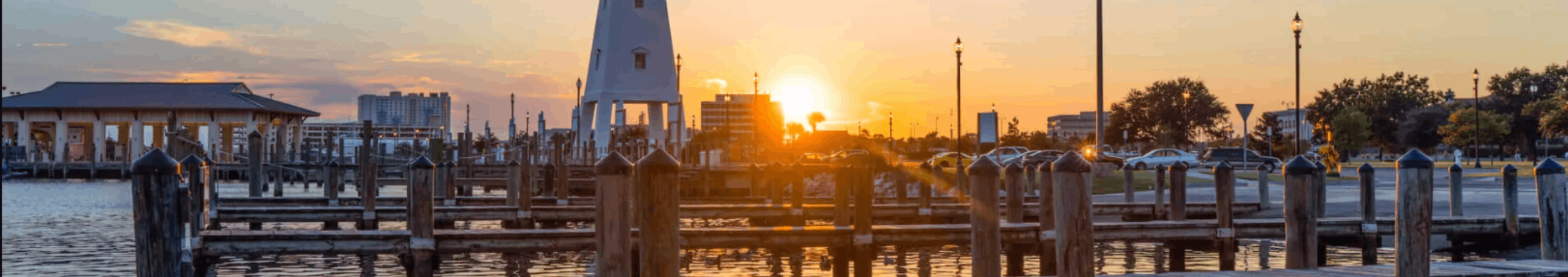 Sun setting over Gulfport, MS harbor