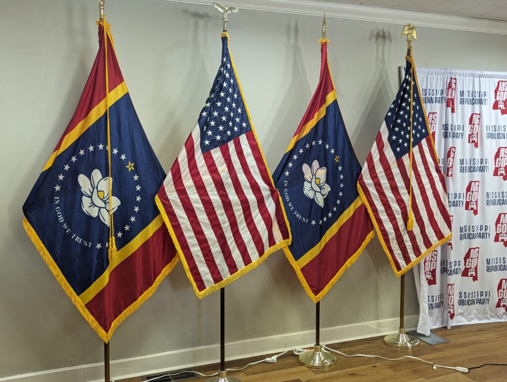 Mississippi State Flag on a guidon next to the United States Flag