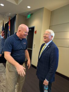 PXL_20250805_180031827 Michael McGill and U.S. Senator Roger Wicker share a laugh while recalling their last meeting at President Donald Trump’s inauguration in Washington, D.C. The two stand casually at the Gulfport Chamber of Commerce’s 2025 Legislative Luncheon.