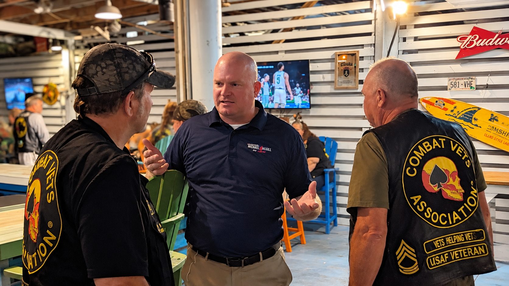 Michael McGill talking with Mississippi veterans in a clubhouse