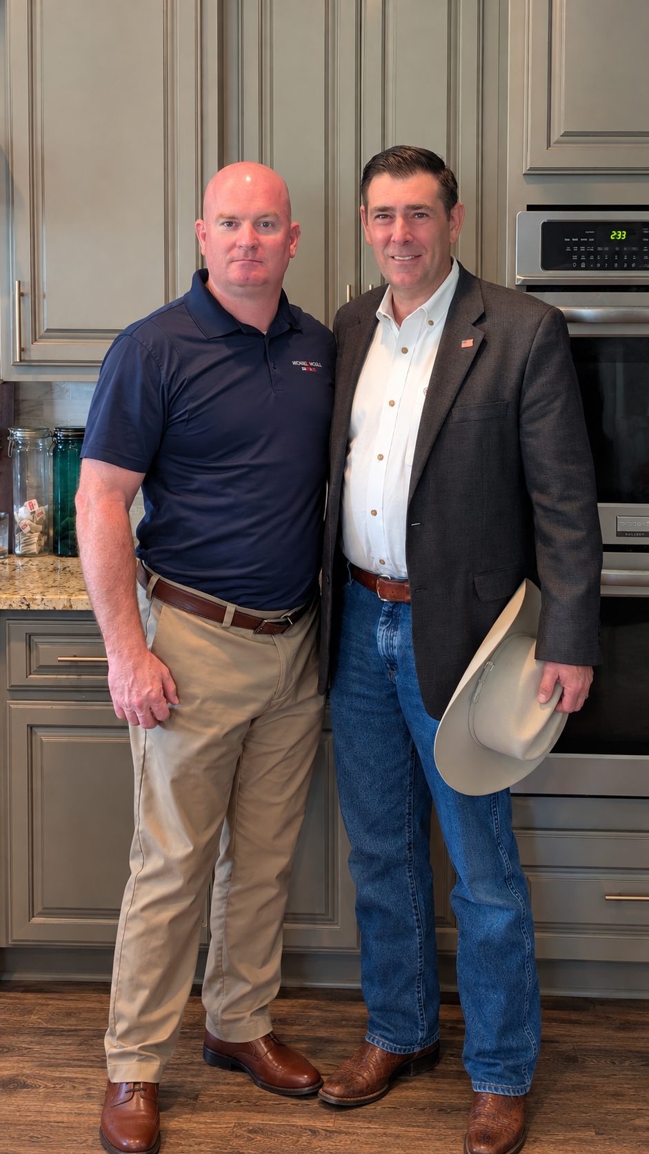 Michael McGill and another man standing side by side in a kitchen